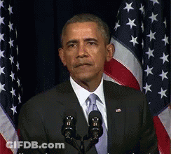 Man In Suit And Tie Speaking Into Microphone GIF