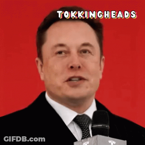 Man In Suit And Tie Speaking Into Microphone Tokingheads GIF