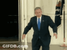 Man In Suit And Tie Standing GIF