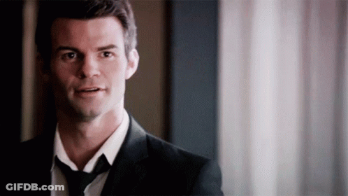 Man In Suit And Tie Standing GIF