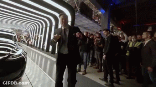 Man In Suit And Tie Standing Before Crowd GIF