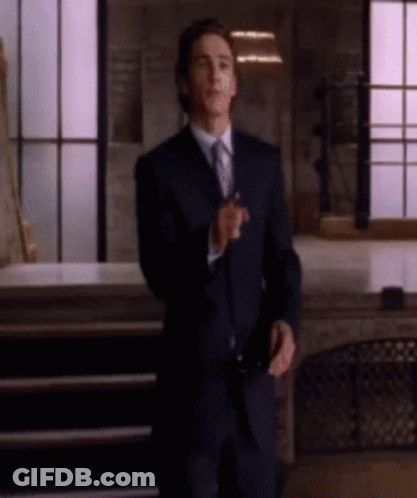 Man In Suit And Tie Standing GIF