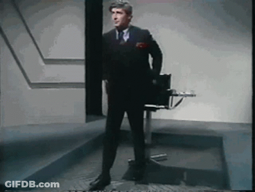 Man In Suit And Tie Standing GIF