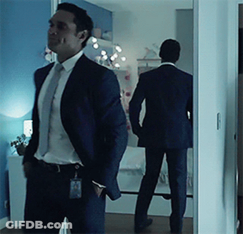 Man In Suit And Tie Standing GIF