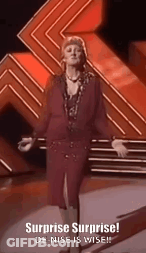 Man In Suit And Tie Standing In Crowd GIF