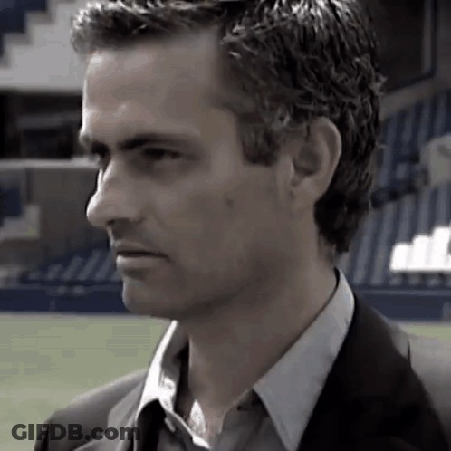 Man In Suit And Tie Standing In Field GIF