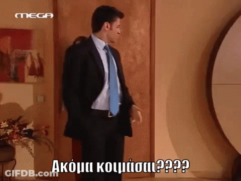 Man In Suit And Tie Standing In Front Of Door With Mega GIF