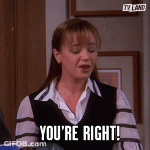 Man In Suit And Tie Standing In Front Of Framed Picture GIF