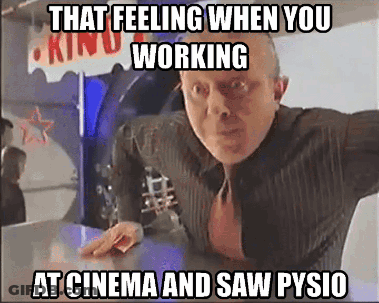Man In Suit And Tie Standing In Front Of Kind Sign GIF