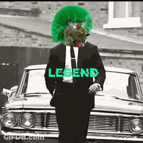 Man In Suit And Tie Standing In Front Of Legend Car GIF