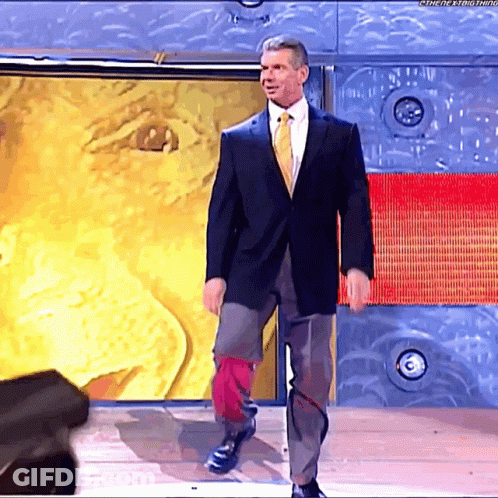 Man In Suit And Tie Standing In Front Of Wall Saying The Next Thing GIF