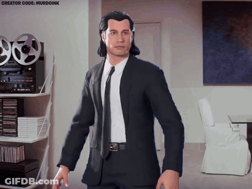 Man In Suit And Tie Standing In Living Room With Murdoink GIF
