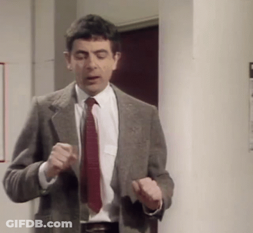 Man In Suit And Tie Standing GIF