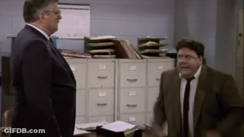 Man In Suit And Tie Standing Next To Another Man GIF