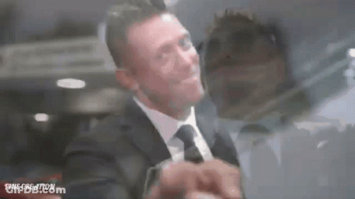 Man In Suit And Tie Standing GIF