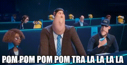 Man In Suit And Tie Standing With Minions GIF