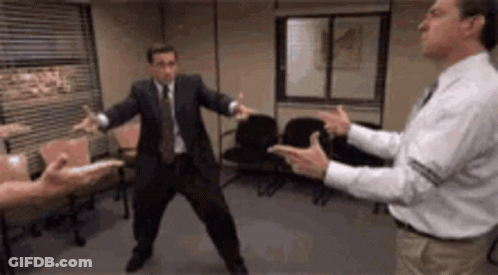Man In Suit And Tie Standing With Other Men GIF