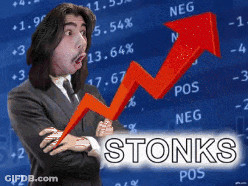 Man In Suit And Tie Stands Before Stonks Graph GIF