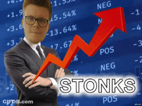 Man In Suit And Tie Stands Before Stonks Graph GIF