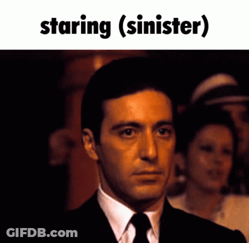 Man In Suit And Tie Staring (Siner) GIF