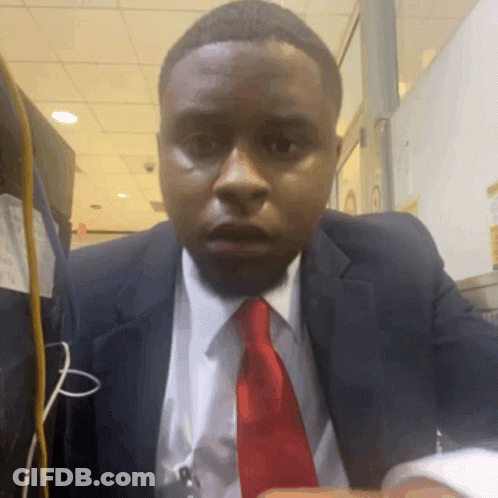 Man In Suit And Tie Surprised At Camera GIF