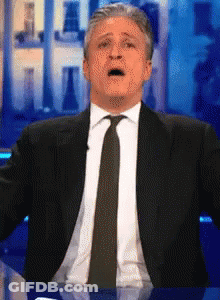 Man In Suit And Tie Surprised Face GIF