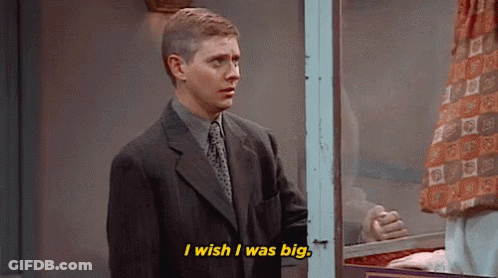 Man In Suit And Tie Talking In Front Of Window GIF