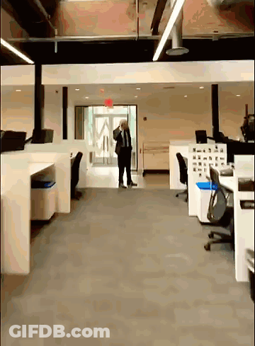 Man In Suit And Tie Talking On Cell Phone GIF