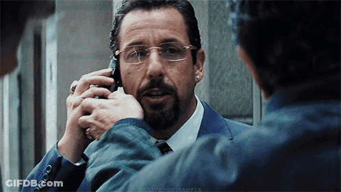 Man In Suit And Tie Talking On Cellphone GIF