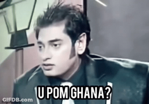 Man In Suit And Tie Talking On Couch GIF
