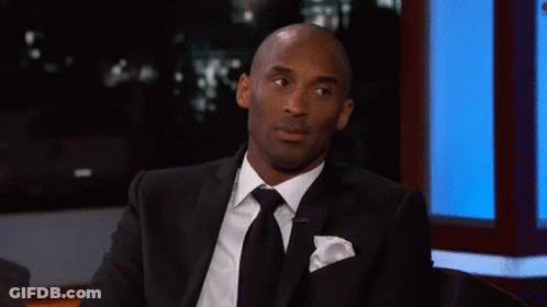 Man In Suit And Tie Talking On TV Show GIF