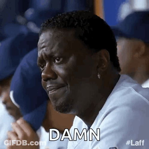 Man In Suit And Tie Talking To Blue Car GIF