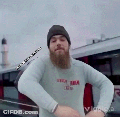 Man In Suit And Tie Talking To TV GIF