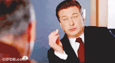 Man In Suit And Tie Talking To Woman At Mirror GIF