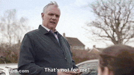 Man In Suit And Tie Talking To Woman Holding Cell Phone GIF