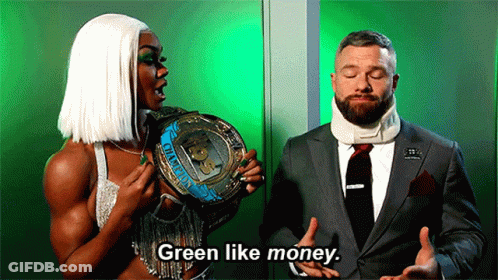 Man In Suit And Tie Talking To Woman In White Wig GIF