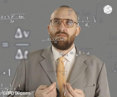 Man In Suit And Tie Teaching Math GIF