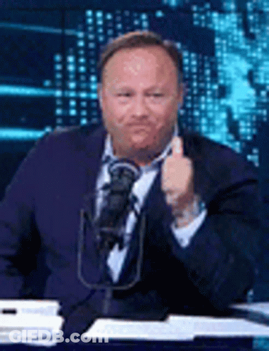 Man In Suit And Tie Thumbs Up At Microphone GIF