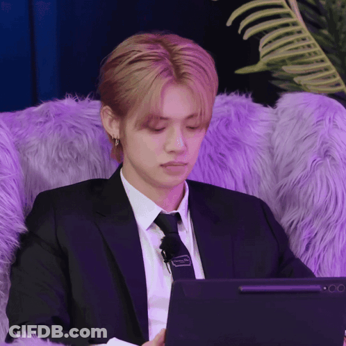 Man In Suit And Tie Using Laptop GIF