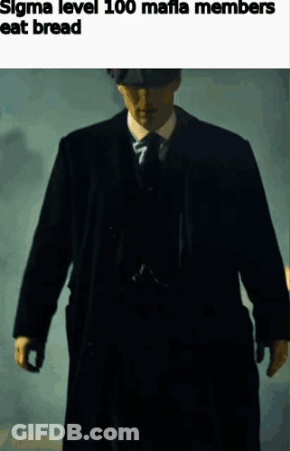 Man In Suit And Tie Walking In Dark GIF