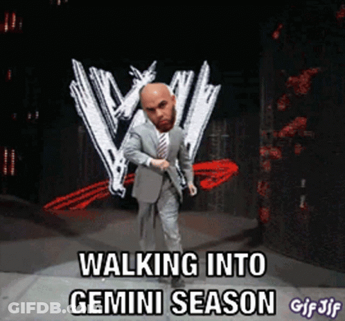 Man In Suit And Tie Walking Into Gemini Season GIF
