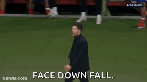 Man In Suit And Tie Walking On Soccer Field GIF