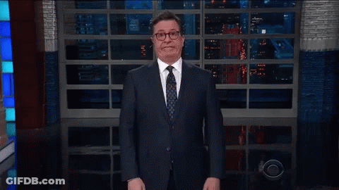 Man In Suit And Tie Walking Past CBS Logo GIF