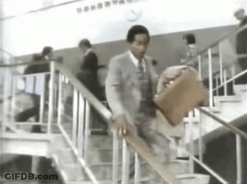 Man In Suit And Tie Walking Up Stairs GIF