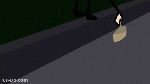 Man In Suit And Tie Watching Skull On Screen GIF