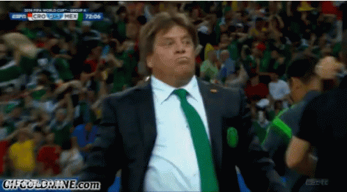Man In Suit And Tie Watching Soccer Game Sponsored By ESPN GIF