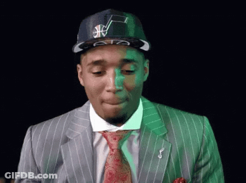 Man In Suit And Tie Wearing Basketball Hat GIF