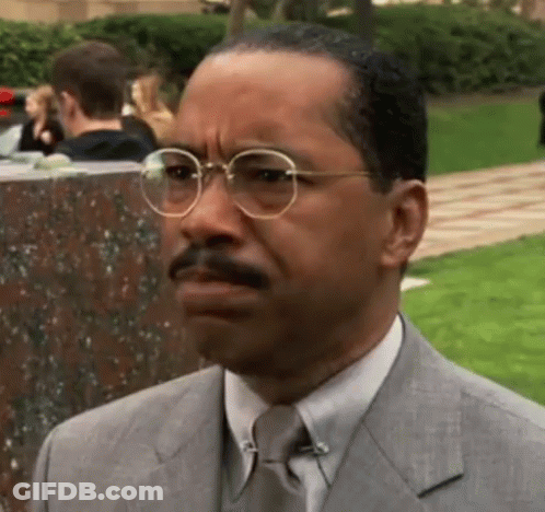 Man In Suit And Tie Wearing Glasses GIF
