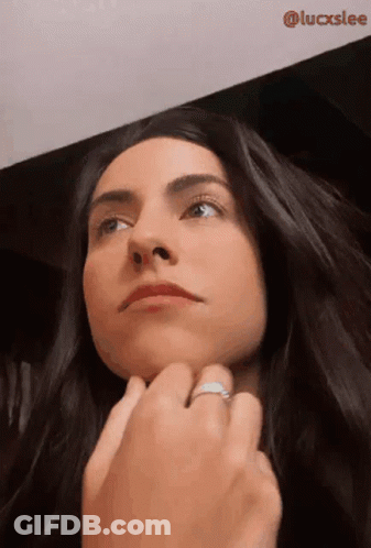 Man In Suit And Tie Wearing Green Mask GIF