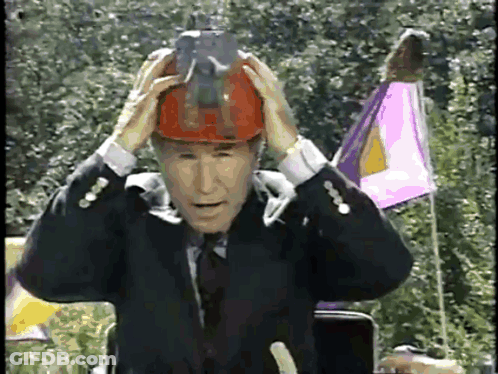 Man In Suit And Tie Wearing Hard Hat GIF